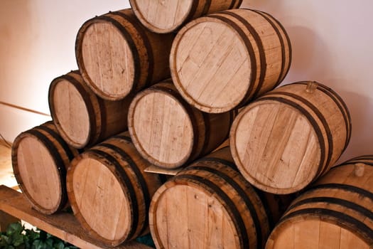 wooden wine barrels in the wineyard cellar
