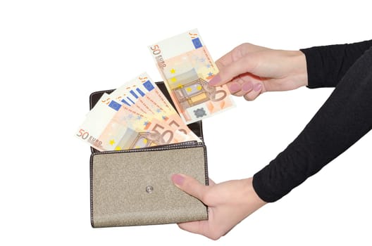 Female hands pulling out banknote from purse with fan of fifty euro banknotes isolated