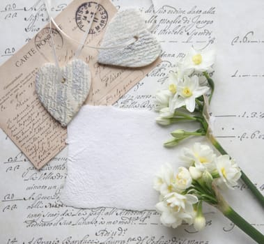 white narcissus and salt dough ornament on script art papers