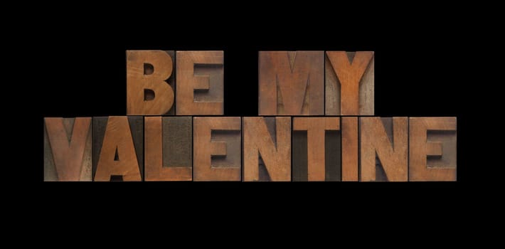 the words 'be my valentine' in old letterpress wood type