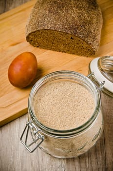 Black homemade bread, rye flour and egg , close-up