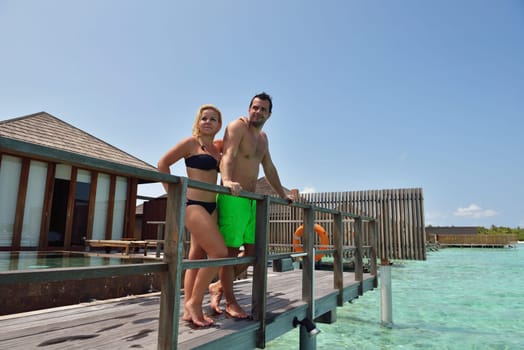 happy young  couple at summer vacation have fun and relax at beautiful sunny  day on beach