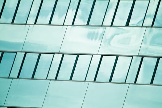View of a modern and shiny glass skyscraper.