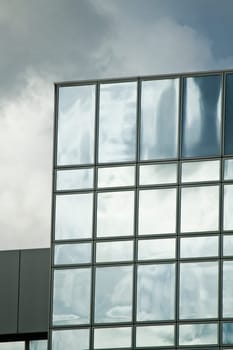 View of a modern and shiny glass skyscraper.