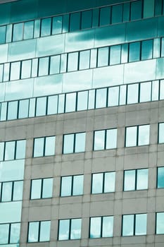 View of a modern and shiny glass skyscraper.