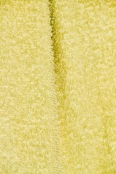 Close up view of the texture of a light green bathing towel.