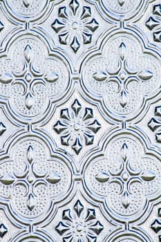 Close view of the flower texture in a glass window.