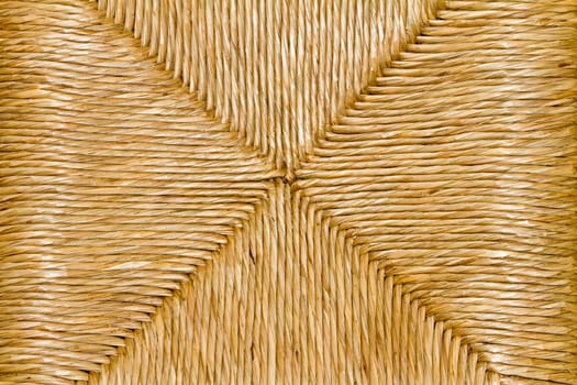 Texture of a traditional handcrafted technic of chair construction made with rattan palm plant by the Portuguese.