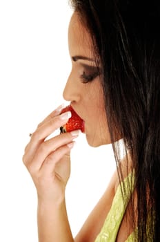 A close up shoot on a gorgeous teen girl with long black hair biding in a big strawberry, enjoying the tasty, for white background.