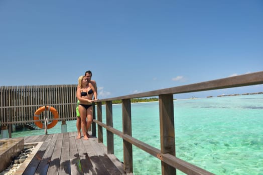 happy young  couple at summer vacation have fun and relax at beautiful sunny  day on beach