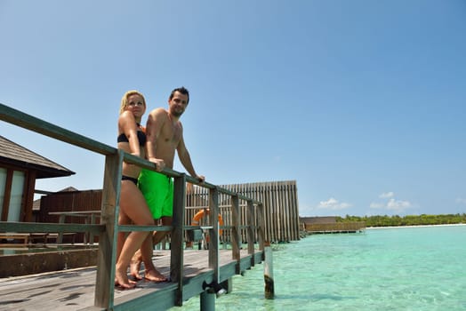 happy young  couple at summer vacation have fun and relax at beautiful sunny  day on beach