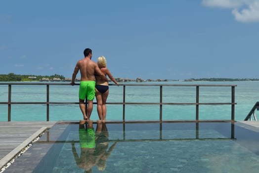 happy young  couple at summer vacation have fun and relax at beautiful sunny  day on beach