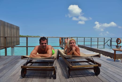 happy young  couple at summer vacation have fun and relax at beautiful sunny  day on beach