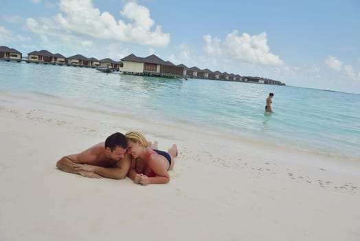 happy young  couple at summer vacation have fun and relax at beautiful sunny  day on beach