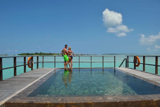 happy young  couple at summer vacation have fun and relax at beautiful sunny  day on beach