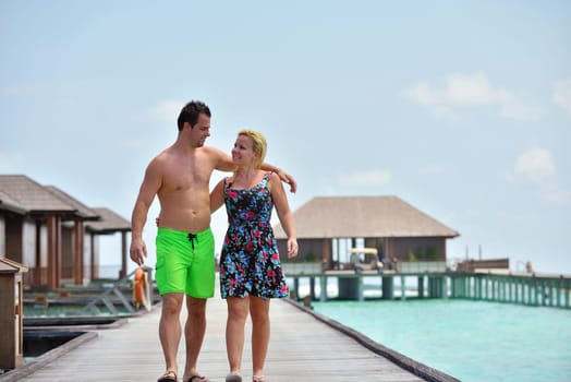 happy young  couple at summer vacation have fun and relax at beautiful sunny  day on beach