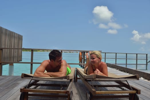 happy young  couple at summer vacation have fun and relax at beautiful sunny  day on beach