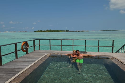 happy young  couple at summer vacation have fun and relax at beautiful sunny  day on beach