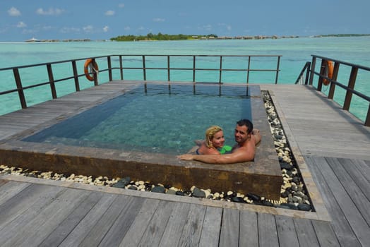 happy young  couple at summer vacation have fun and relax at beautiful sunny  day on beach