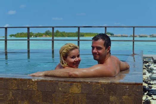 happy young  couple at summer vacation have fun and relax at beautiful sunny  day on beach
