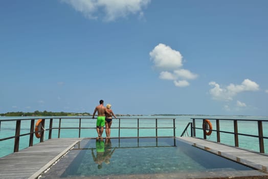 happy young  couple at summer vacation have fun and relax at beautiful sunny  day on beach