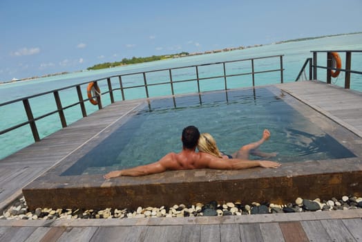 happy young  couple at summer vacation have fun and relax at beautiful sunny  day on beach