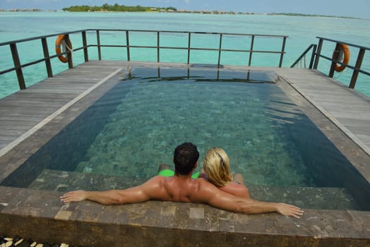 happy young  couple at summer vacation have fun and relax at beautiful sunny  day on beach