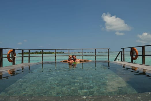 happy young  couple at summer vacation have fun and relax at beautiful sunny  day on beach