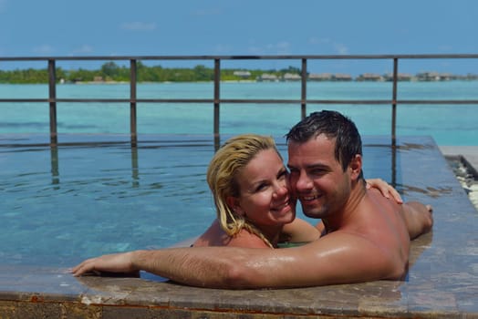 happy young  couple at summer vacation have fun and relax at beautiful sunny  day on beach