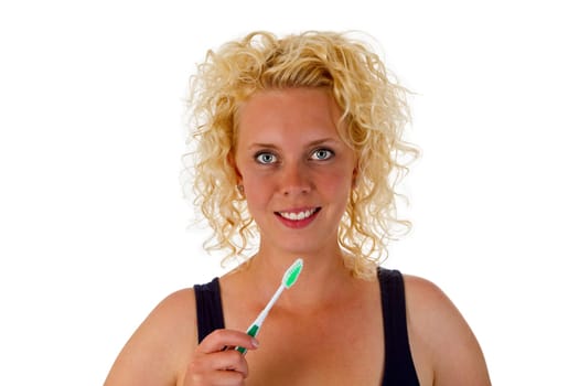 Young woman with toothbrush exposed on white background