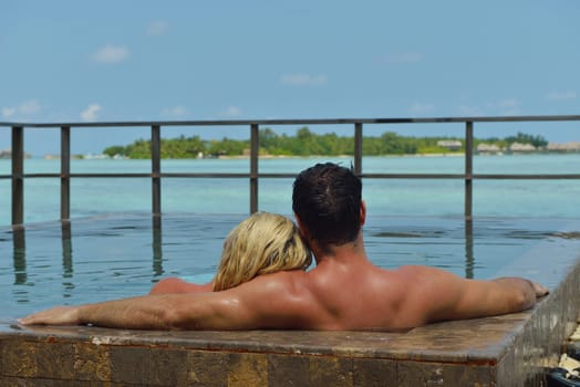 happy young  couple at summer vacation have fun and relax at beautiful sunny  day on beach