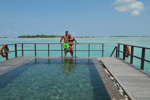 happy young  couple at summer vacation have fun and relax at beautiful sunny  day on beach