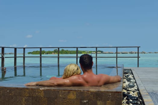 happy young  couple at summer vacation have fun and relax at beautiful sunny  day on beach