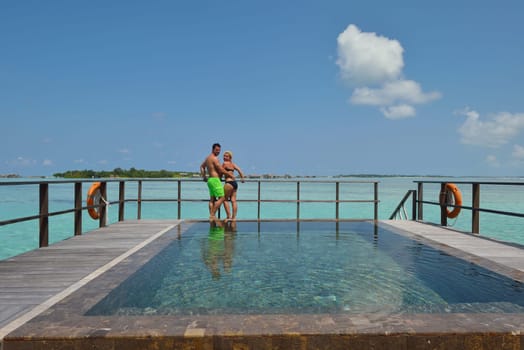 happy young  couple at summer vacation have fun and relax at beautiful sunny  day on beach