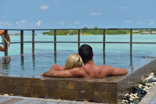 happy young  couple at summer vacation have fun and relax at beautiful sunny  day on beach