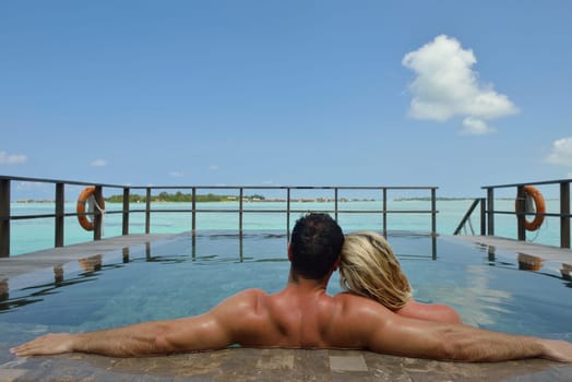 happy young  couple at summer vacation have fun and relax at beautiful sunny  day on beach