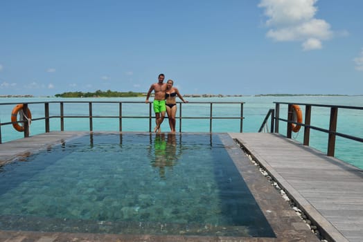 happy young  couple at summer vacation have fun and relax at beautiful sunny  day on beach