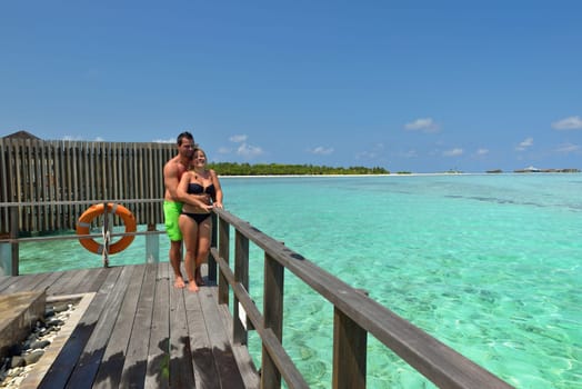 happy young  couple at summer vacation have fun and relax at beautiful sunny  day on beach
