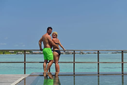 happy young  couple at summer vacation have fun and relax at beautiful sunny  day on beach