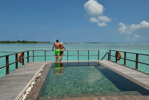 happy young  couple at summer vacation have fun and relax at beautiful sunny  day on beach