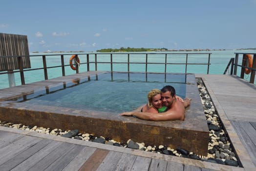 happy young  couple at summer vacation have fun and relax at beautiful sunny  day on beach