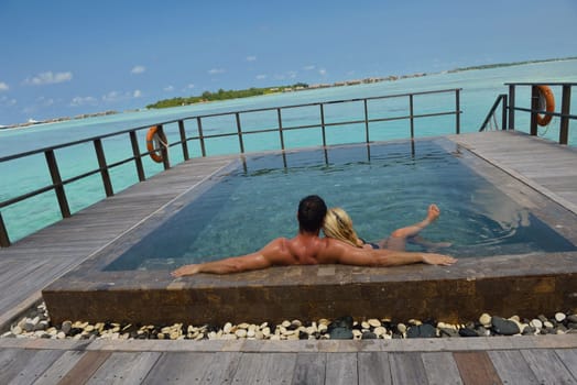 happy young  couple at summer vacation have fun and relax at beautiful sunny  day on beach
