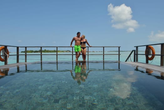 happy young  couple at summer vacation have fun and relax at beautiful sunny  day on beach