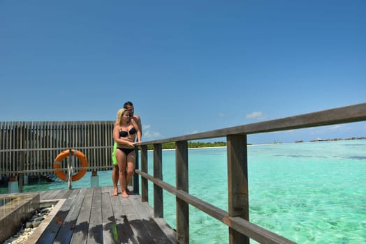 happy young  couple at summer vacation have fun and relax at beautiful sunny  day on beach
