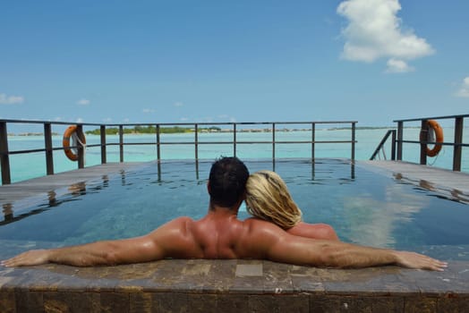 happy young  couple at summer vacation have fun and relax at beautiful sunny  day on beach