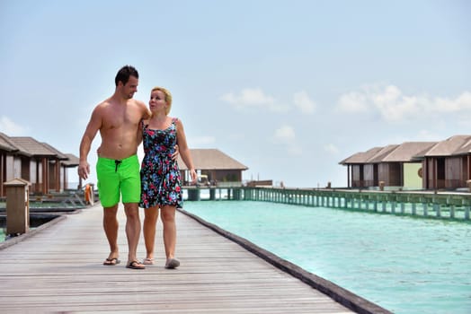 happy young  couple at summer vacation have fun and relax at beautiful sunny  day on beach