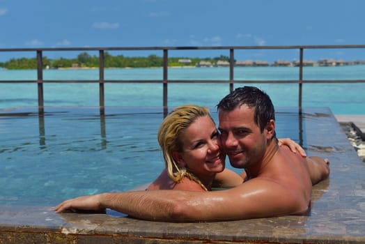 happy young  couple at summer vacation have fun and relax at beautiful sunny  day on beach