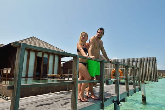 happy young  couple at summer vacation have fun and relax at beautiful sunny  day on beach