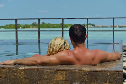 happy young  couple at summer vacation have fun and relax at beautiful sunny  day on beach