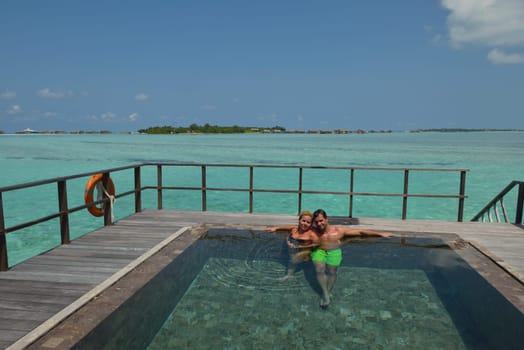 happy young  couple at summer vacation have fun and relax at beautiful sunny  day on beach